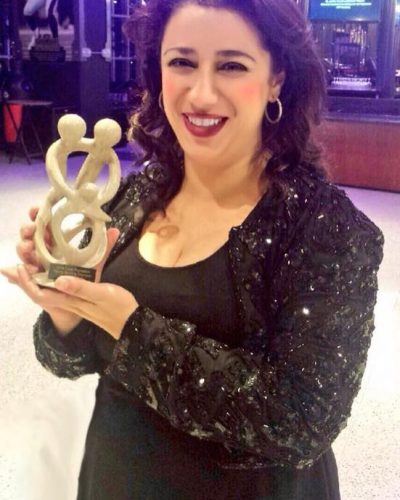 Receiving an award for Family Building from Cade Foundation